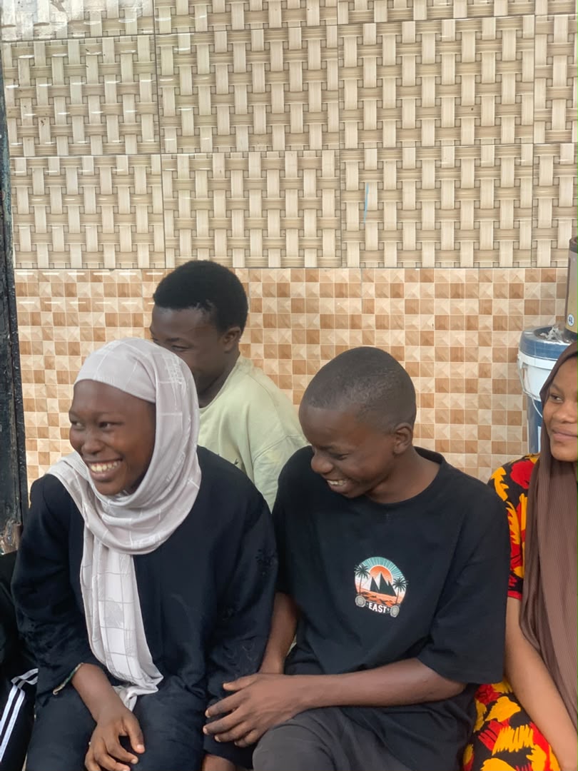 Young participants sharing a happy moment during an Impact Crew activity