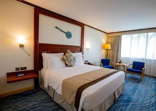 Comfortable hotel guest room with blue accents