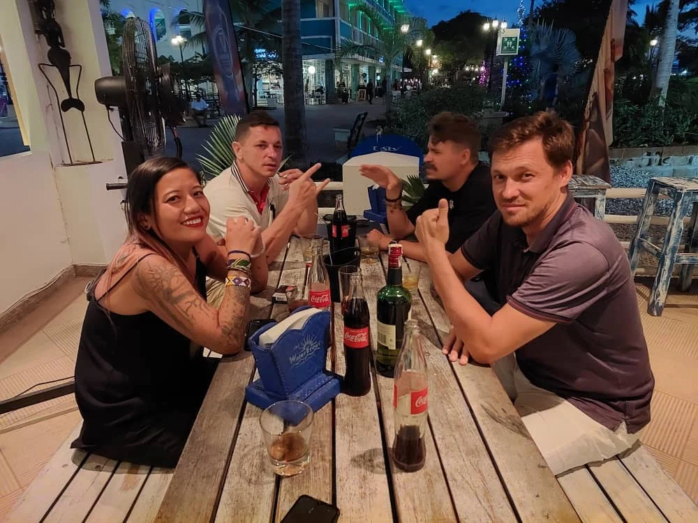 Guests sharing an evening together around a restaurant table in Tanzania