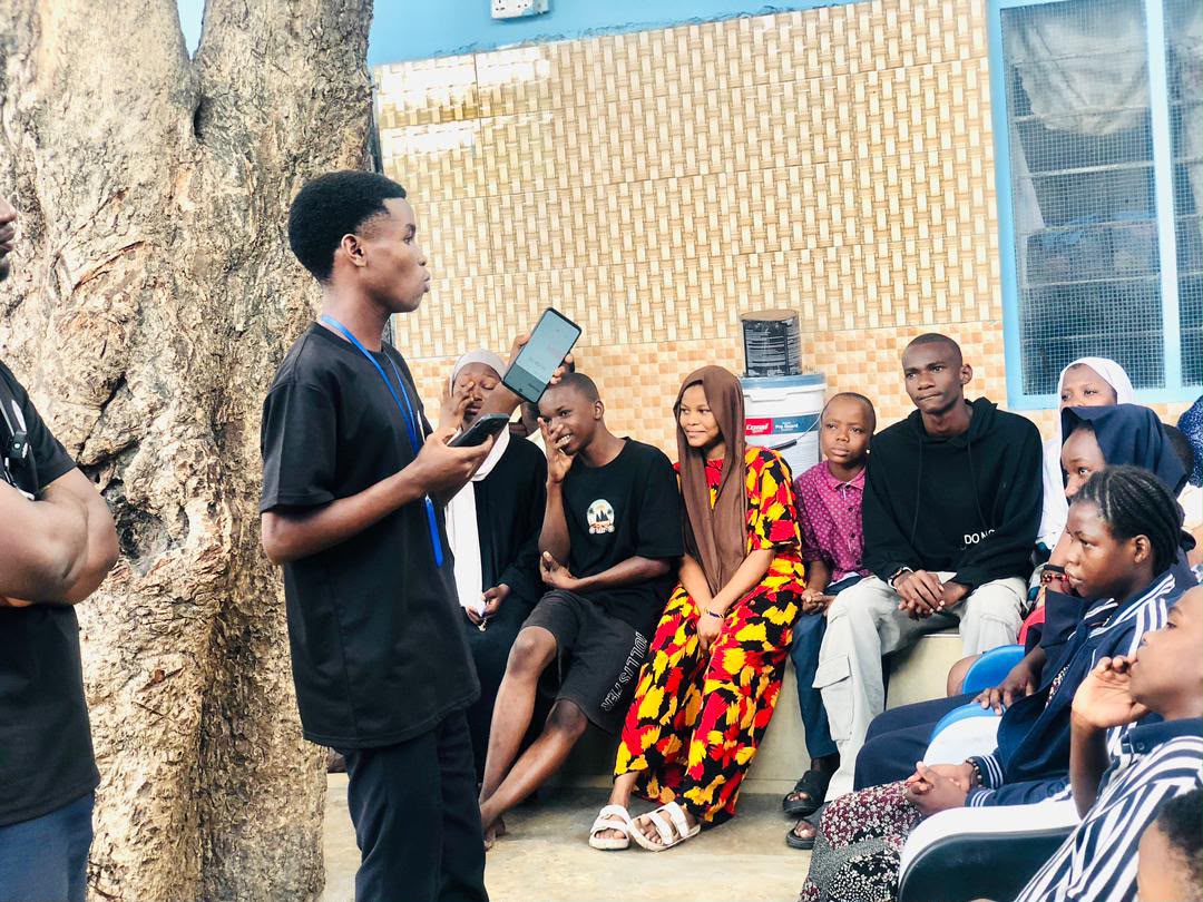 Impact Crew volunteer speaking during a youth group session