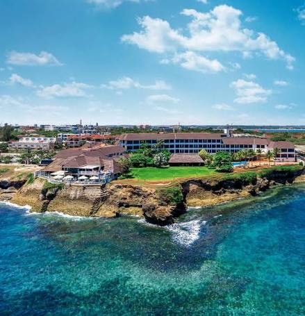 Coastal resort on cliffs above turquoise water