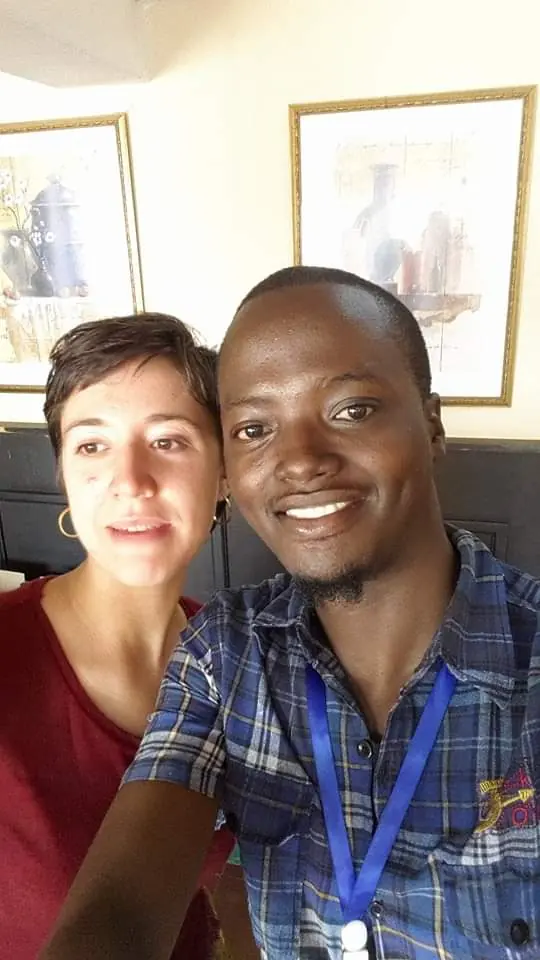 A visitor and a Tanzania World Link guide taking a smiling selfie together